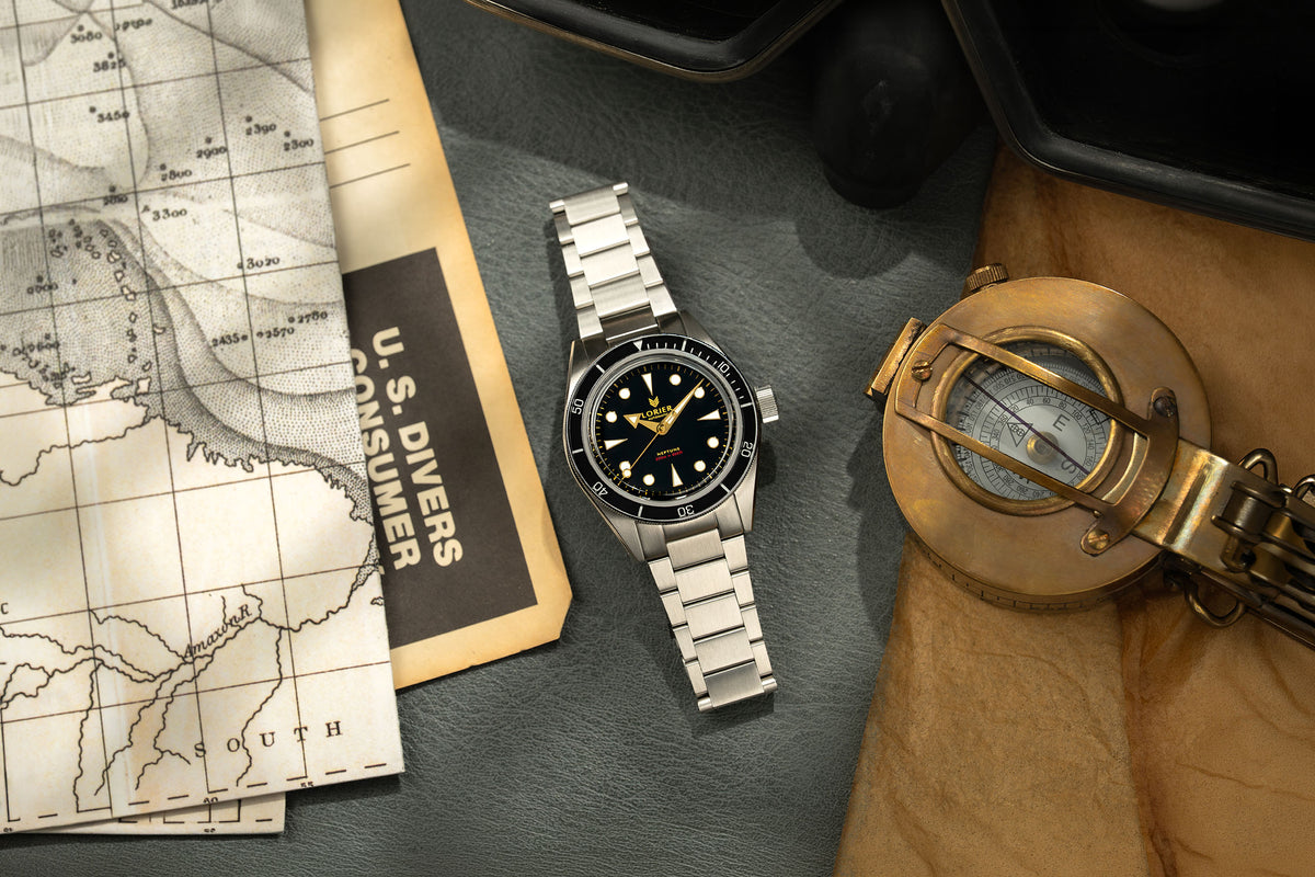 Lorier Neptune in a flat lay with related ephemera